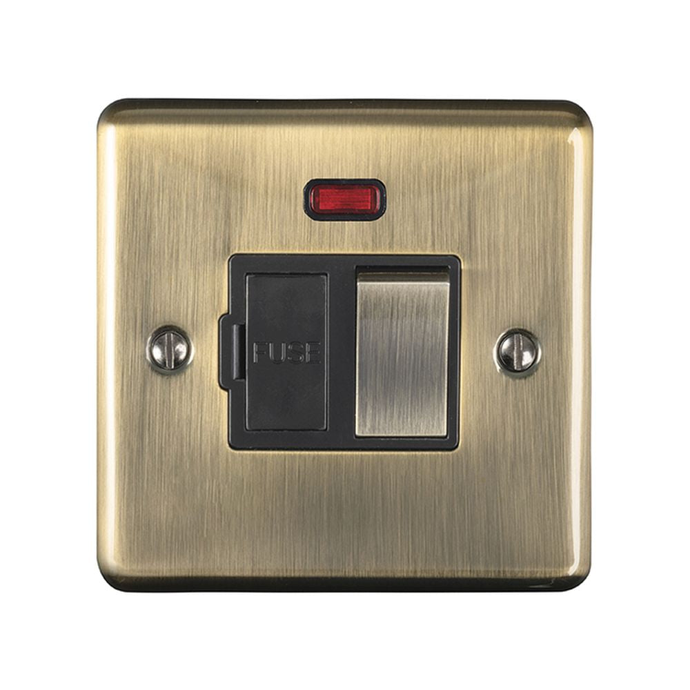 This is an image showing Eurolite Enhance Decorative Switched Fuse Spur With Neon Indicator - Antique Brass (With Black Trim) enswfnabb available to order from T.H. Wiggans Ironmongery in Kendal, quick delivery and discounted prices.