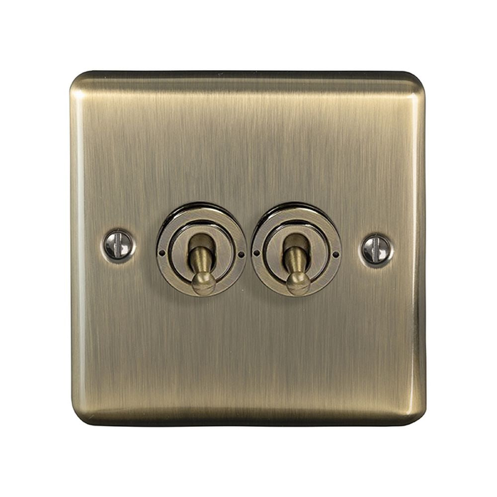 This is an image showing Eurolite Enhance Decorative 2 Gang Toggle Switch - Antique Brass (With Black Trim) ent2swabb available to order from T.H. Wiggans Ironmongery in Kendal, quick delivery and discounted prices.