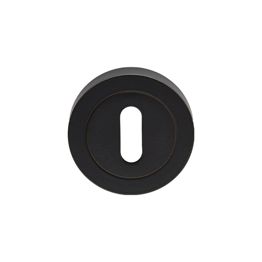 This is an image of Carlisle Brass - Lock Escutcheon - Matt Black available to order from T.H Wiggans Architectural Ironmongery in Kendal, quick delivery and discounted prices.