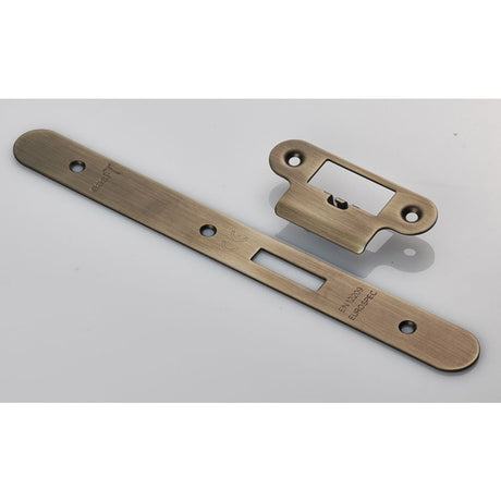 This is an image of a Eurospec - Forend Strike and Fixing Pack to suit Din Latch (Security) Radius that is availble to order from T.H Wiggans Architectural Ironmongery in Kendal.