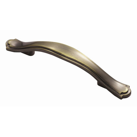 This is an image of a FTD - Stepped Edge Bow Handle 76mm - Antique Burnished Brass that is availble to order from T.H Wiggans Architectural Ironmongery in Kendal in Kendal.