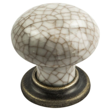 This is an image of a FTD - Porcelain Mushroom Pattern Knob 35mm - Antique Brass Ivory Crackle Glaze that is availble to order from T.H Wiggans Architectural Ironmongery in Kendal in Kendal.