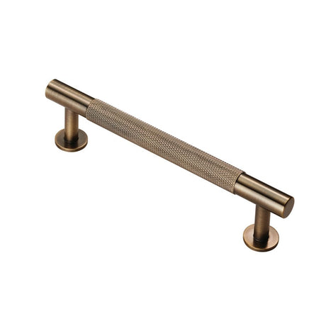 This is an image of a FTD - Knurled Pull Handle 128mm c/c - Antique Brass that is availble to order from T.H Wiggans Architectural Ironmongery in Kendal in Kendal.