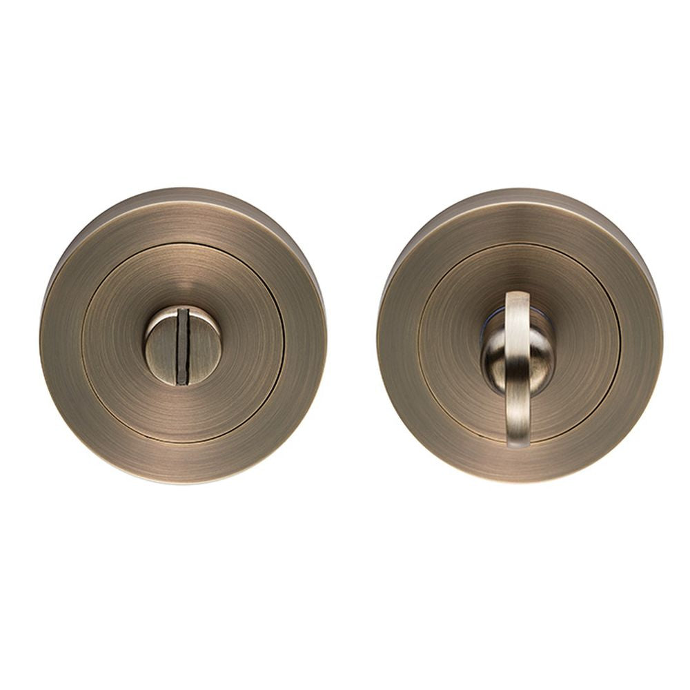 This is an image of Carlisle Brass - Thumb turn & Release - Antique Brass available to order from T.H Wiggans Architectural Ironmongery in Kendal, quick delivery and discounted prices.