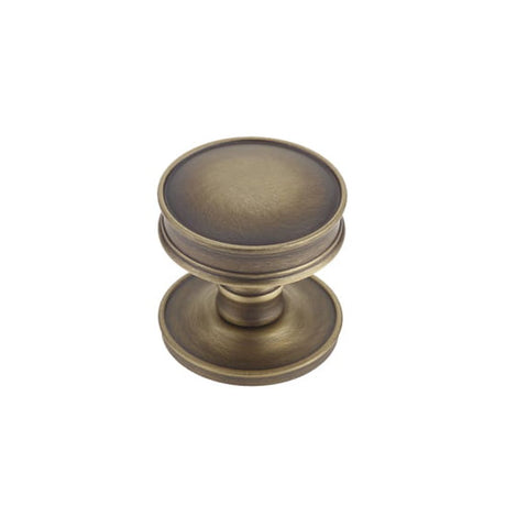 This is an image of a Burlington - Berkeley cupboard knob - Antique Brass that is availble to order from T.H Wiggans Architectural Ironmongery in Kendal in Kendal.
