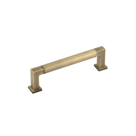 This is an image of a Burlington - Westminster Cabinet Handle 128mm CTC - Antique Brass that is availble to order from T.H Wiggans Architectural Ironmongery in Kendal in Kendal.
