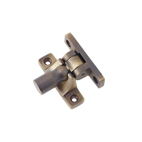 This is an image of a Burlington - sash fastener - Antique Brass that is availble to order from T.H Wiggans Architectural Ironmongery in Kendal in Kendal.