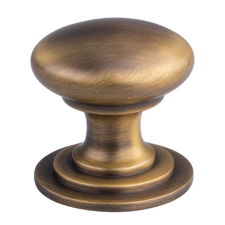 This is an image of a FTD - Victorian Cupboard Knob 50mm - Antique Brass that is availble to order from T.H Wiggans Architectural Ironmongery in Kendal in Kendal.