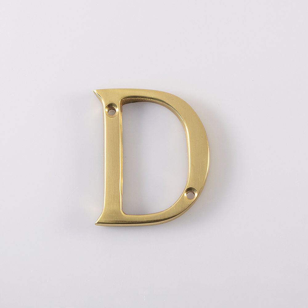 This is an image of Carlisle Brass - Letter D - Polished Brass available to order from T.H Wiggans Architectural Ironmongery in Kendal, quick delivery and discounted prices.