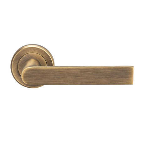 This is an image of Serozzetta - Edge Lever on Round Rose - Antique Brass available to order from T.H Wiggans Architectural Ironmongery in Kendal, quick delivery and discounted prices.