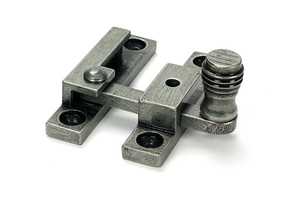 This is an image of From The Anvil - Pewter Prestbury Quadrant Fastener - Narrow available to order from T.H. Wiggans Ironmongery in Kendal.