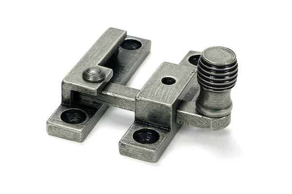 This is an image of From The Anvil - Pewter Beehive Quadrant Fastener - Narrow available to order from T.H. Wiggans Ironmongery in Kendal.