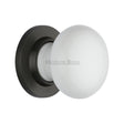 This is an image of a Heritage Brass - White Knob with Matt Bronze base, 5010-mb that is available to order from T.H Wiggans Ironmongery in Kendal.