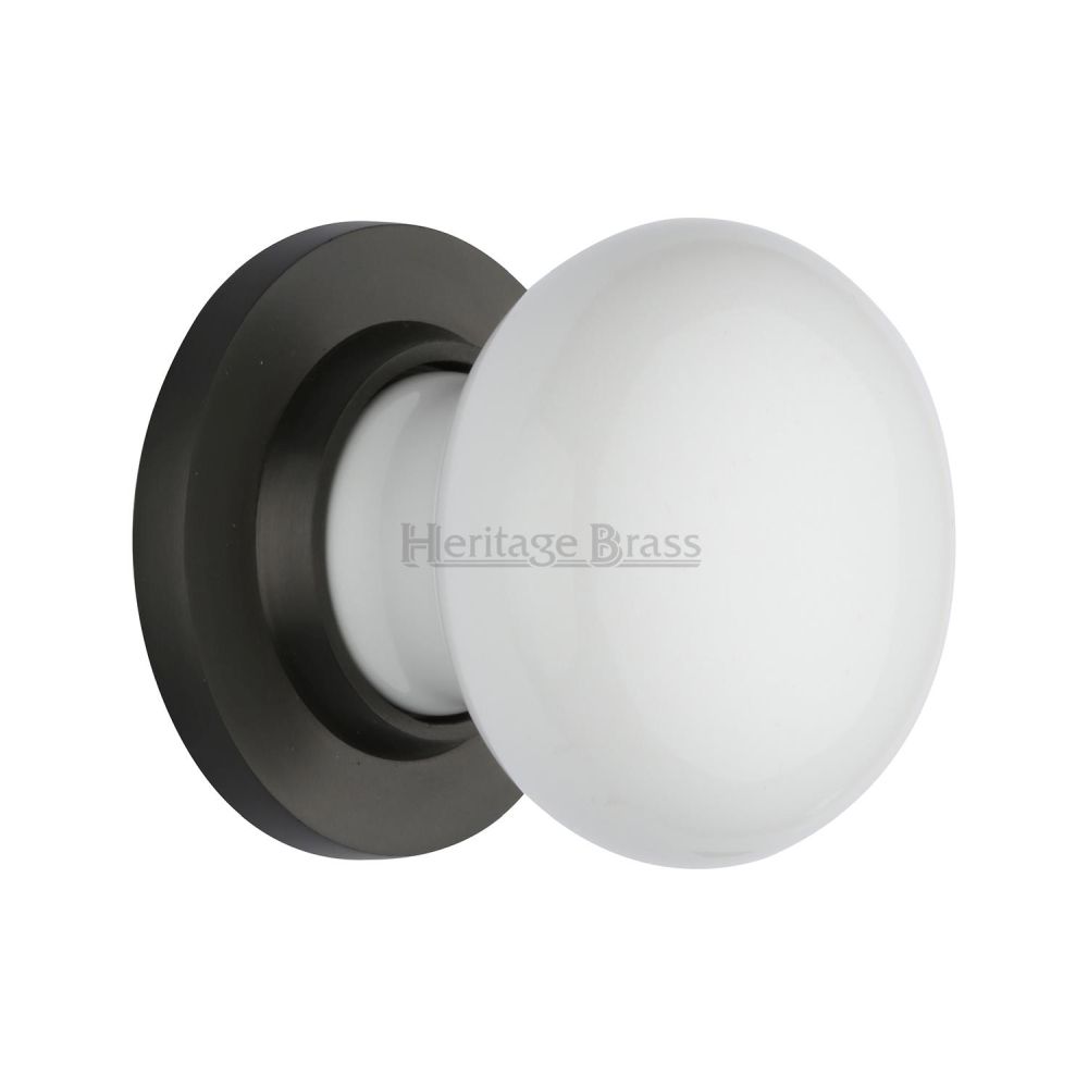 This is an image of a Heritage Brass - White Knob with Matt Bronze base, 5010-mb that is available to order from T.H Wiggans Ironmongery in Kendal.