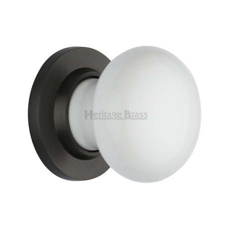 This is an image of a Heritage Brass - White Knob with Matt Bronze base, 5010-mb that is available to order from T.H Wiggans Ironmongery in Kendal.