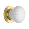 This is an image of a Heritage Brass - White Knob with Polished Brass base, 5010-pb that is available to order from T.H Wiggans Ironmongery in Kendal.