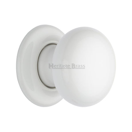 This is an image of a Heritage Brass - White Knob with Porcelain base, 5010-pr that is available to order from T.H Wiggans Ironmongery in Kendal.