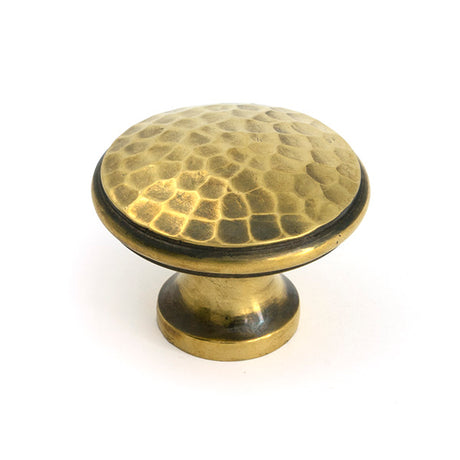 This is an image of From The Anvil - Aged Brass Hammered Cabinet Knob - Large available to order from T.H. Wiggans Ironmongery in Kendal.