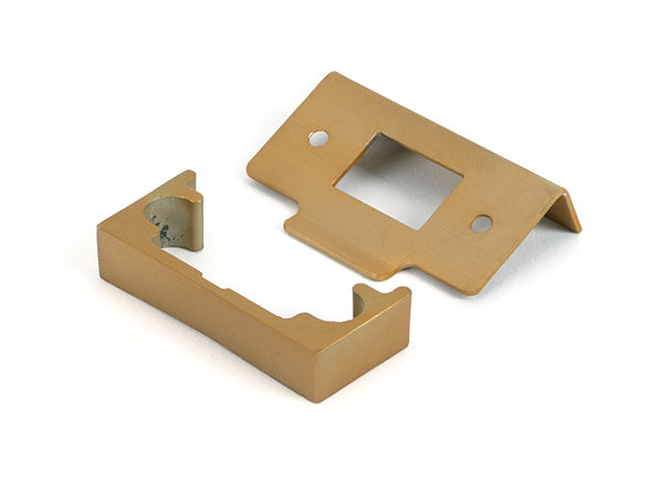 This is an image of From The Anvil - Satin Brass Â½" Rebate Kit for Tubular Mortice Latch available to order from T.H. Wiggans Ironmongery in Kendal.