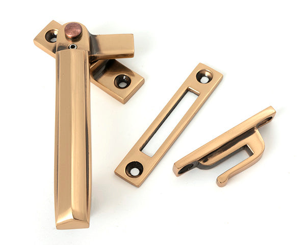 This is an image of From The Anvil - Polished Bronze Locking Art Deco Fastener - LH available to order from T.H. Wiggans Ironmongery in Kendal.