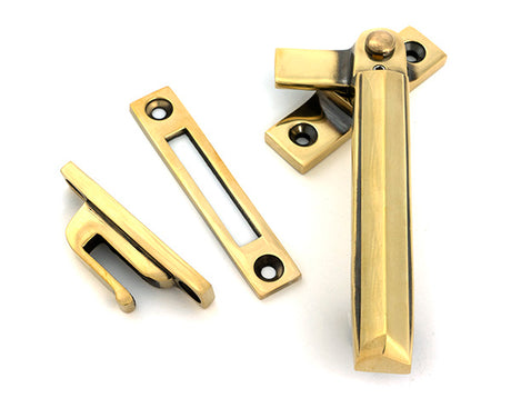 This is an image of From The Anvil - Aged Brass Locking Art Deco Fastener - RH available to order from T.H. Wiggans Ironmongery in Kendal.