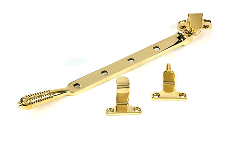This is an image of From The Anvil - Polished Brass 10" Reeded Stay (Steel Window) available to order from T.H. Wiggans Ironmongery in Kendal.