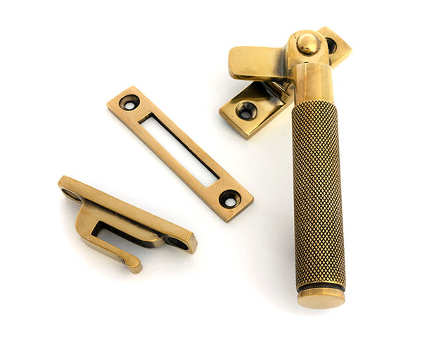 This is an image of From The Anvil - Aged Brass Locking Brompton Fastener â€“ RH available to order from T.H. Wiggans Ironmongery in Kendal.