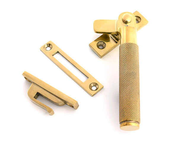 This is an image of From The Anvil - Polished Brass Locking Brompton Fastener â€“ RH available to order from T.H. Wiggans Ironmongery in Kendal.