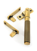 This is an image of From The Anvil - Aged Brass Night-Vent Locking Brompton Fastener available to order from T.H. Wiggans Ironmongery in Kendal.