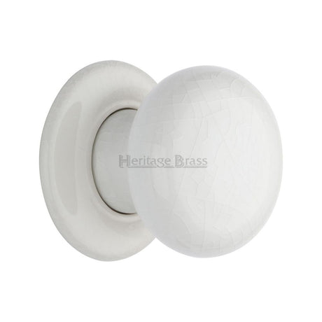 This is an image of a Heritage Brass - White Crackle Knob with Porcelain base, 7010-pr that is available to order from T.H Wiggans Ironmongery in Kendal.