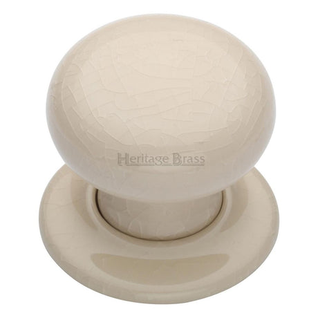 This is an image of a Heritage Brass - Cream Crackle Knob with Porcelain base, 8010-pr that is available to order from T.H Wiggans Ironmongery in Kendal.