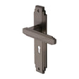 This is an image of a Heritage Brass - Door Handle Lever Lock Astoria Design Matt Bronze Finish, ast5900-mb that is available to order from T.H Wiggans Ironmongery in Kendal.