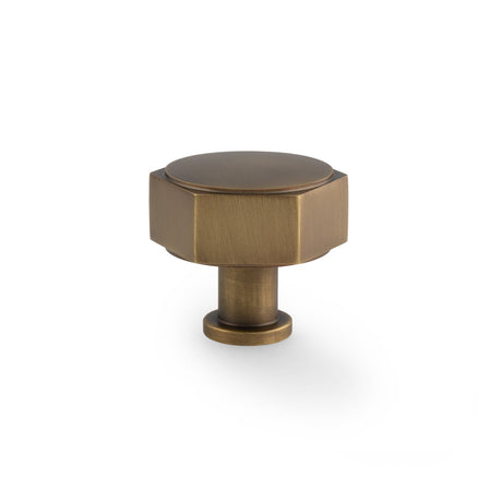 This is an image showing Alexander & Wilks - Vesper Hex Cabinet Knob - Antique Brass aw828-40-ab available to order from T.H. Wiggans Ironmongery in Kendal, quick delivery and discounted prices.