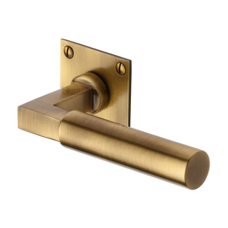 This is an image of a Heritage Brass - Door Handle Lever Latch on Square Rose Bauhaus Design Antique Bras, bau1926-at that is available to order from T.H Wiggans Ironmongery in Kendal.