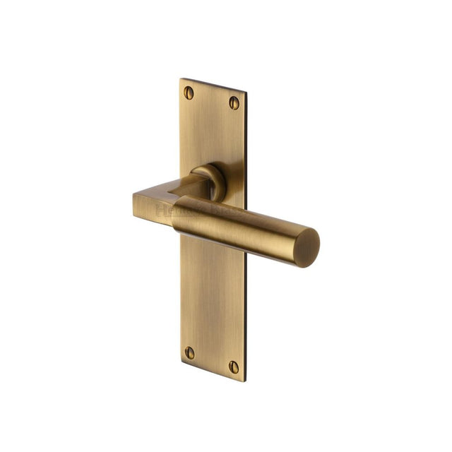 This is an image of a Heritage Brass - Door Handle Lever Latch Bauhaus Design Antique Brass Finish, bau7310-at that is available to order from T.H Wiggans Ironmongery in Kendal.