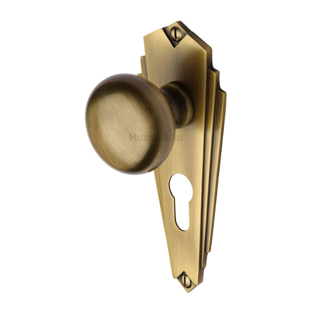 This is an image of a Heritage Brass - Mortice Knob on Euro Profile Plate Broadway Design Antique Brass F, br1848-at that is available to order from T.H Wiggans Ironmongery in Kendal.