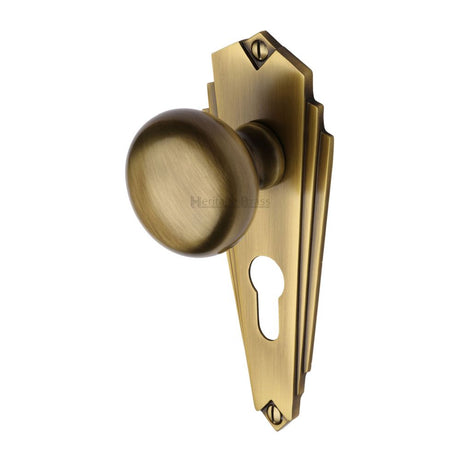 This is an image of a Heritage Brass - Mortice Knob on Euro Profile Plate Broadway Design Antique Brass F, br1848-at that is available to order from T.H Wiggans Ironmongery in Kendal.
