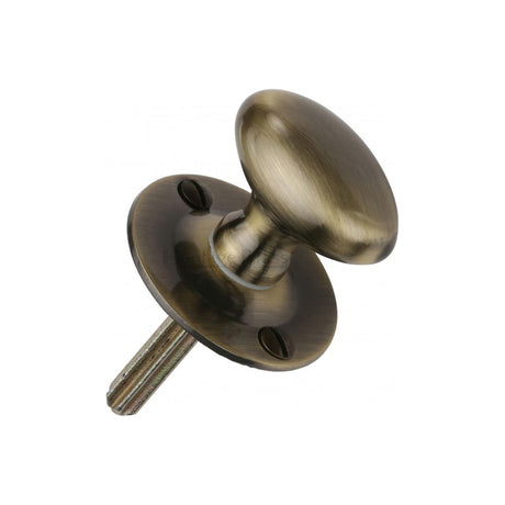 This is an image of a Heritage Brass - Oval Thumbturn w/o Bolt Antique Brass Finish, bt5-at that is available to order from T.H Wiggans Ironmongery in Kendal.