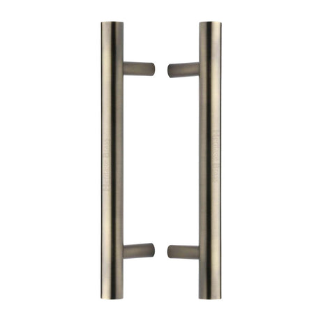 This is an image of a Heritage Brass - Back to Back Door Pull Handle Bar Design 305mm Antique Brass Finish, btb1361-305-at that is available to order from T.H Wiggans Ironmongery in Kendal.