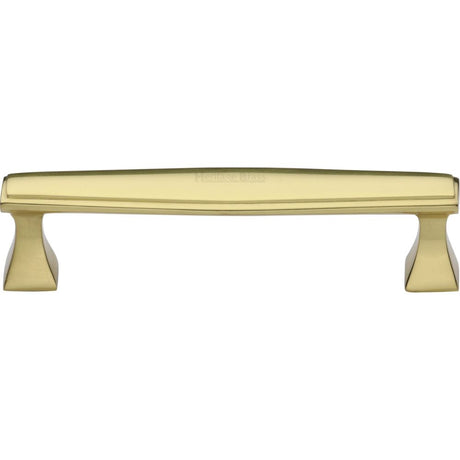 This is an image of a Heritage Brass - Cabinet Pull Deco Design 128mm CTC Polished Brass Finish, c0334-128-pb that is available to order from T.H Wiggans Ironmongery in Kendal.