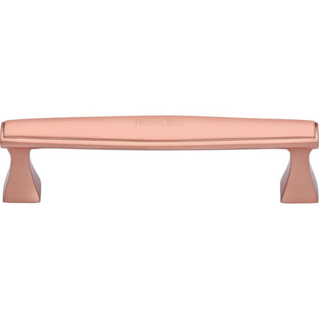 This is an image of a Heritage Brass - Cabinet Pull Deco Design 128mm CTC Satin Rose Gold Finish, c0334-128-srg that is available to order from T.H Wiggans Ironmongery in Kendal.