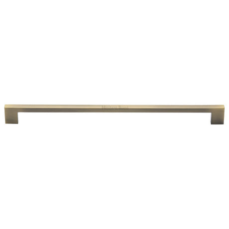 This is an image of a Heritage Brass - Cabinet Pull Metro Design 320mm CTC Antique Brass Finish, c0337-320-at that is available to order from T.H Wiggans Ironmongery in Kendal.