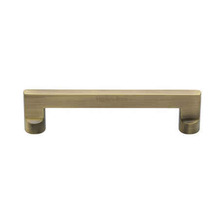 This is an image of a Heritage Brass - Cabinet Pull Apollo Design 128mm CTC Antique Brass Finish, c0345-128-at that is available to order from T.H Wiggans Ironmongery in Kendal.
