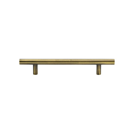 This is an image of a Heritage Brass - Cabinet Pull T-Bar Design 128mm CTC Antique Brass Finish, c0361-128-at that is available to order from T.H Wiggans Ironmongery in Kendal.
