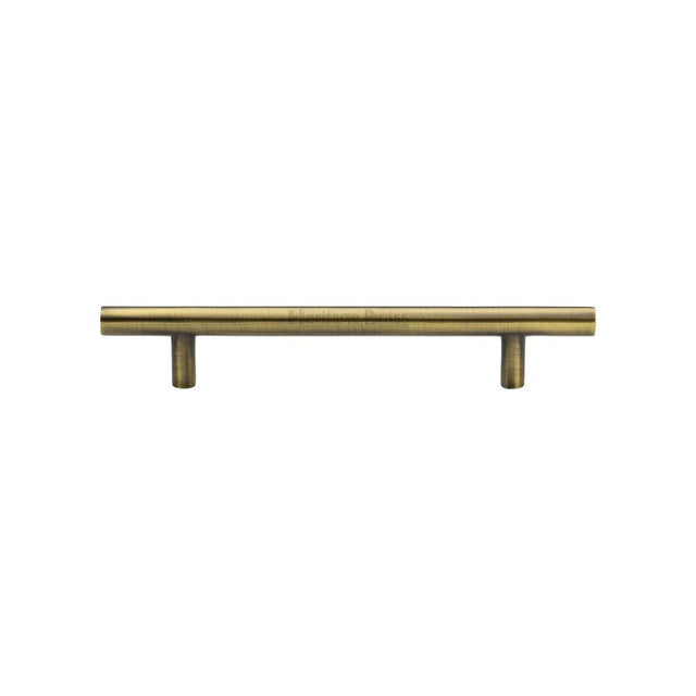 This is an image of a Heritage Brass - Cabinet Pull T-Bar Design 128mm CTC Antique Brass Finish, c0361-128-at that is available to order from T.H Wiggans Ironmongery in Kendal.