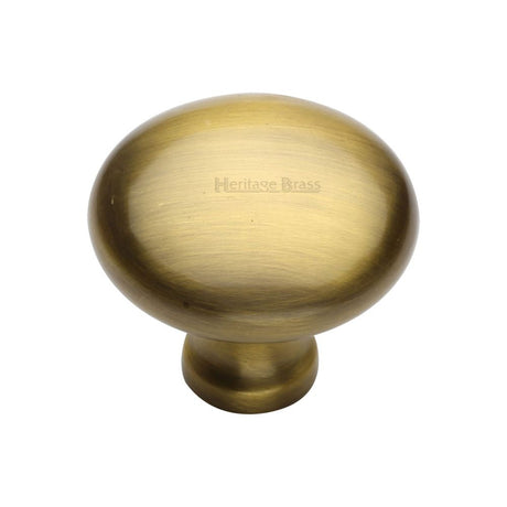 This is an image of a Heritage Brass - Cabinet Knob Victorian Round Design 38mm Antique Brass Finish, c113-38-at that is available to order from T.H Wiggans Ironmongery in Kendal.