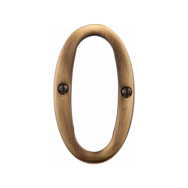 This is an image of a Heritage Brass - Numeral 0 Face Fix 76mm (3") Antique Brass Finish, c1560-0-at that is available to order from T.H Wiggans Ironmongery in Kendal.