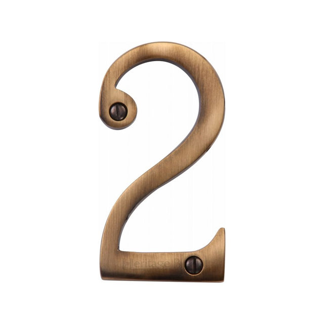 This is an image of a Heritage Brass - Numeral 2 Face Fix 76mm (3") Antique Brass Finish, c1560-2-at that is available to order from T.H Wiggans Ironmongery in Kendal.