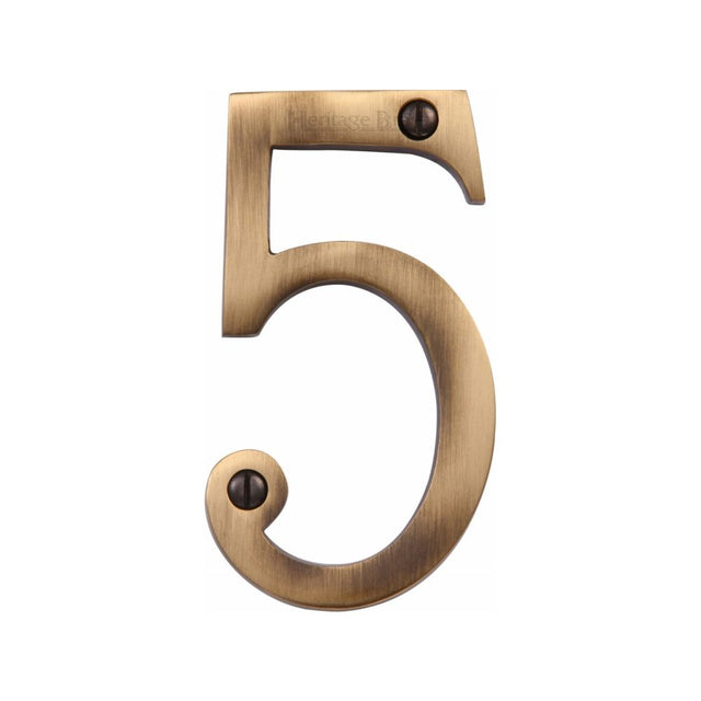 This is an image of a Heritage Brass - Numeral 5 Face Fix 76mm (3") Antique Brass Finish, c1560-5-at that is available to order from T.H Wiggans Ironmongery in Kendal.