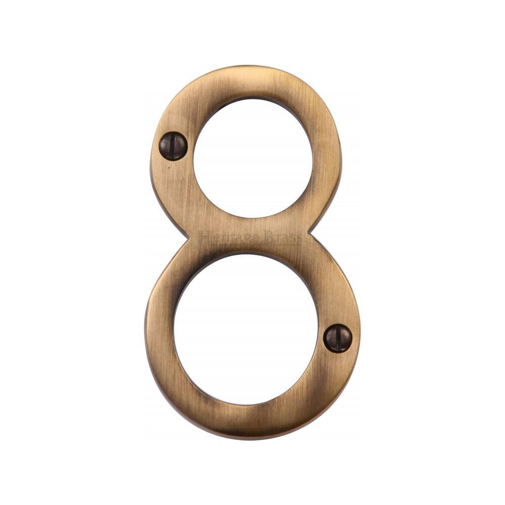 This is an image of a Heritage Brass - Numeral 8 Face Fix 76mm (3") Antique Brass Finish, c1560-8-at that is available to order from T.H Wiggans Ironmongery in Kendal.